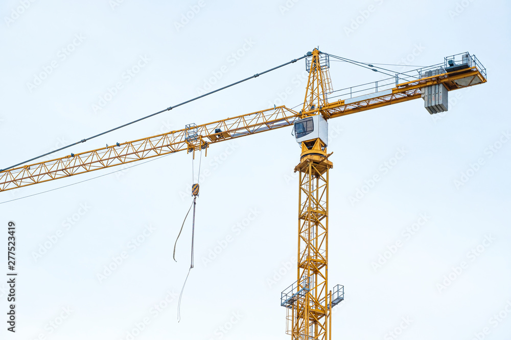 Wall mural crane. construction crane. building crane on the background sky