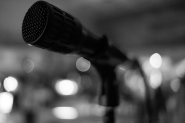 microphone on stand black and white photo