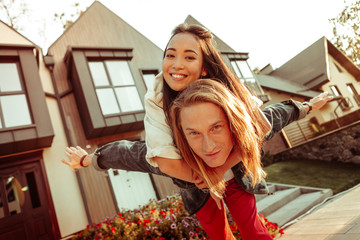 Handsome blonde man spending funny date with his girlfriend