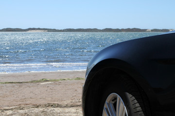 Fototapeta na wymiar Car parking directly at the beach in California