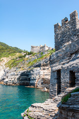 Portovenere, Italy. Seaside village with the gulf of poets that inspired the poems of Byron, a popular tourist destination for beach holidays and tracking. Gulf of poets and Castle of Portovenere.