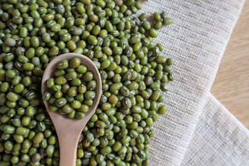 Mung bean seeds have long been used as food for human beings, green beans, seeds that are placed in a white plate, placed on a table with tears and tablecloths....