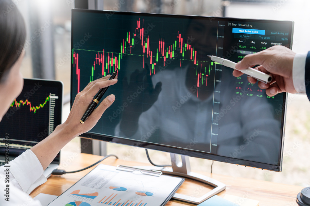 Poster team of stockbrokers discussing with display screens analyzing data, graphs and reports of stock mar