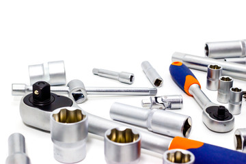 A set of tool heads for loosening screws, bolts and nuts. Ratchet screwdriver. White background