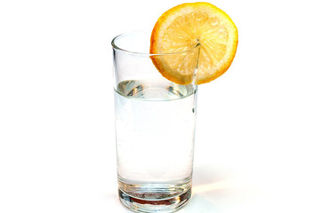 Glass of pure water with lemon isolated on a white background