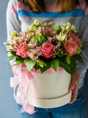 Luxury bouquets of different flowers in a hat box.