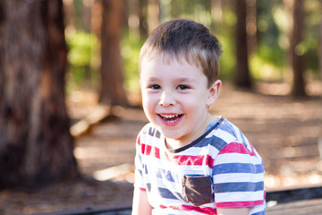 happy child enjoying nature based play outdoors