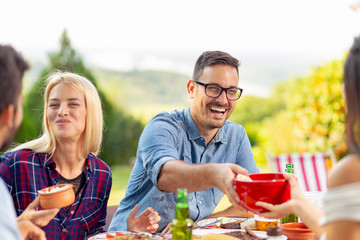 Friends having an outdoor lunch