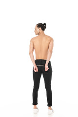 Fototapeta premium back view of sexy shirtless man in handcuffs isolated on white