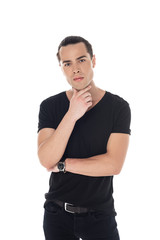 front view of pensive young man in black t-shirt looking at camera isolated on white