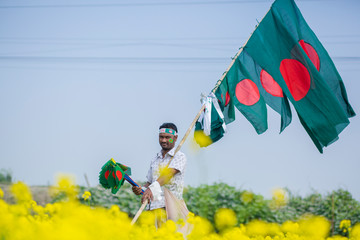 A Hawker sells Bangladeshi national flags