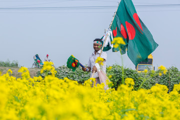 A Hawker sells Bangladeshi national flags
