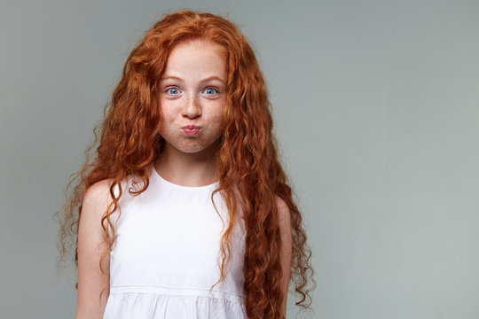 redhead baby with freckles
