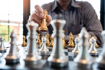 Business man take a king figure checkmate on the chess board game - strategy, management or...