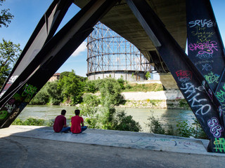 Walking along the Tiber with Gazometro view 3