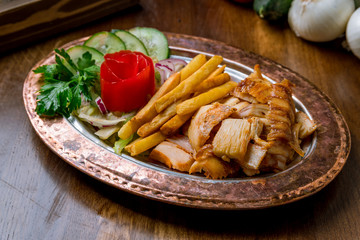 Doner with chicken on copper plate turkish cuisine