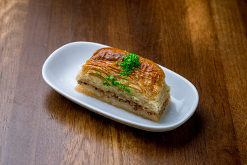 Traditional arabic dessert Baklava on plate. Turkish cuisine