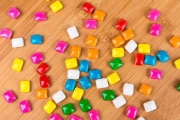 Rounded square unchewed multicolored bubble gum pieces