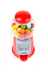 Red plastic bubble gum coin vending machine