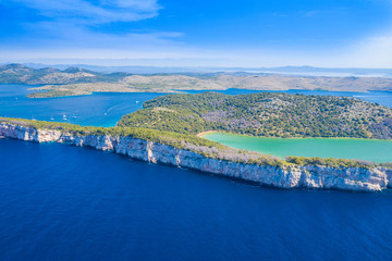 Fototapeta premium Aerial view of the Salt lake in nature park Telascica, Croatia, Dugi otok, big stone cliffs above the sea