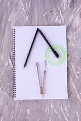 stationery for graphics and architecture. vertically on a gray background is a notebook in a box on...