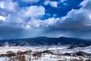 Fototapeta na wymiar View in the countryside with snow in winter of Japan.