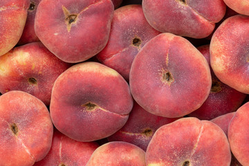 Peach. Flat peaches background. Donut peaches. Saturn peaches. Pan Tao. Colorful fruit background.