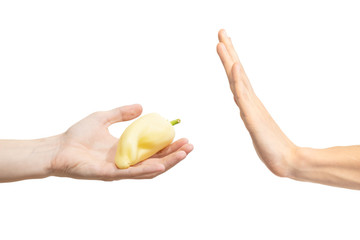 Say no to sweet pepper. Man says no to white pepper. Hand gesture to reject proposal to yellow...