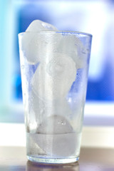 Blue long drink cocktail alcoholic non-alcoholic cold beverage drink. Sweet and refreshing for the summer hot times. Vacation holidays leisure. Blue Lagoon, Curacao, blue cocktail preparation pouring