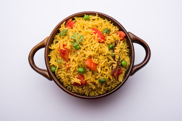 Tomato Rice also known as Tamatar Pilaf/pulav made using basmati rice, served in a bowl. selective focus