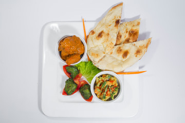 Chicken Harialy Kabab, Chicken Tikka masala curry, Indian Style mix vegetable , plain nan and Green Salad Platter.