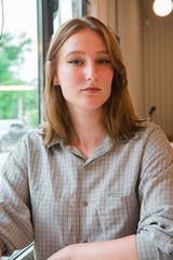 Girl is waiting for a meeting in cafe
