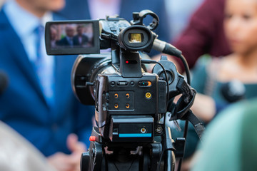 Press Conference Outdoors. Camera at a Media Event