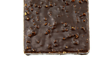 Half chocolate cake with nuts on white background
