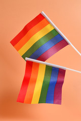 LGBT flag on orange background. Copy space.