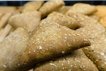 triangle bread with sunflowers seeds and broken flax seeds sold at the baker