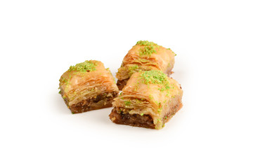 Pistachio baklava on a white background. Dessert.