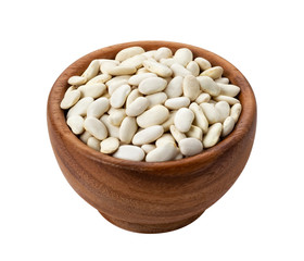 Wooden bowl with dried white beans isolated on white background