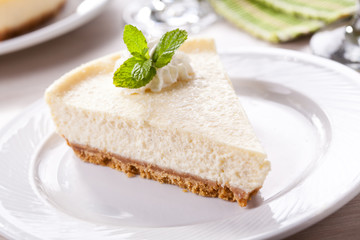 Slice Of Homemade Vanilla Cheesecake With Whipped Cream