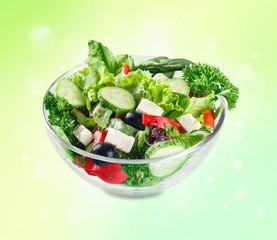 Closeup of Greek salad with feta cheese, cherry tomatoes and lettuce