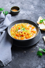 Rice and Pumpkin Indian Soup on Dark Background