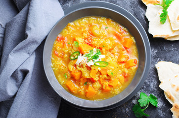 Rice and Pumpkin Indian Soup on Dark Background