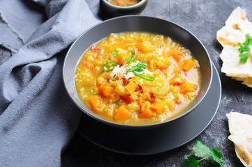 Rice and Pumpkin Indian Soup on Dark Background