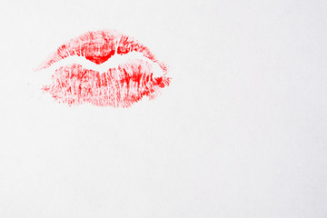 Red lipstick kiss on a white background, copy space.