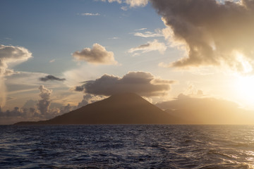 The majestic volcano of Gunung Api rises from the seascape in the Banda Islands of Indonesia. This region is also known as the Spice Islands where the worldwide spice trade was once centered.