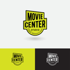 Movie Center logo. Video Production Studio emblem. Symbol of gold award with letters. Scratches, shabby style.