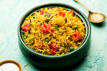 Tomato pulav/Pilaf made using basmati rice, served in a bowl. selective focus