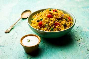 Tomato  pulav/Pilaf made using basmati rice, served in a bowl. selective focus