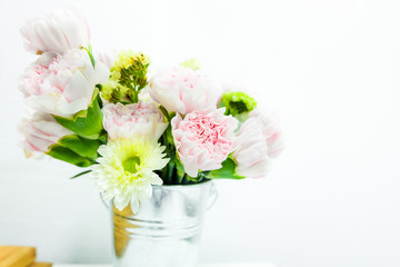 Beautiful carnation flowers in vase on background
