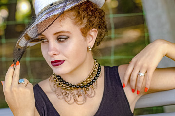 Girl in a hat with a veil